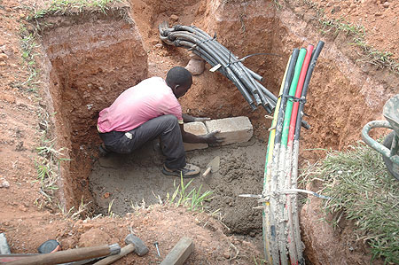 A man connects Optic Fibre Internet cables in Kigali. (File Photo)