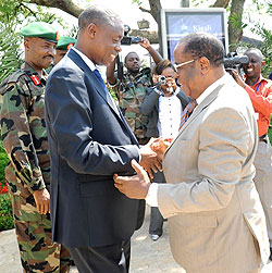 The Minister of Defence, Gen. James Kabarebe (L) welcomes his counterpart Hon. Charles Mwando Nsimba yesterday at Kigali International Airport. (Photo; J. Mbanda)