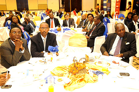 (From Left to Right) NMG Chairman Wilfred Kiboro, Minister of Finance, John Rwangombwa and Dr. Martin Aliker yesterday (Photo; T. Kisambira)