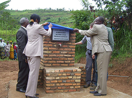 Ministers Ruhamya and Gen.Gatsinzi in the company of Mayor Kangwegye launch water project at Kajevuba cell on Tuesday. (Photo A Gahene)