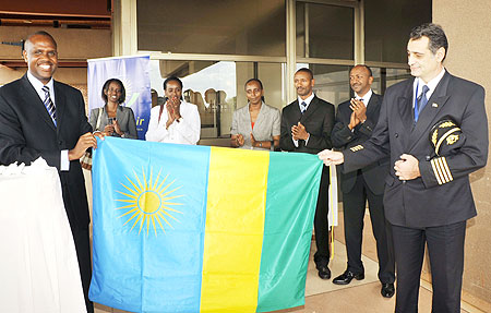 Mirenge handing over national flag to the aircraft Captain,  Zafeirakis Charalampos