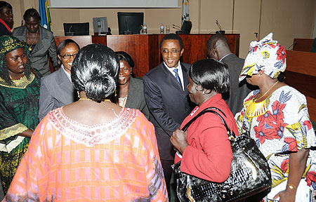 Senate President, Vincent Biruta (C) greets Southern Sudan Women MPs. (Photo J Mbanda)