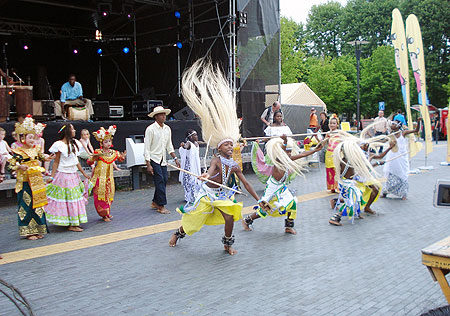 Rwamakondera dance troupe take to the stage with other children.