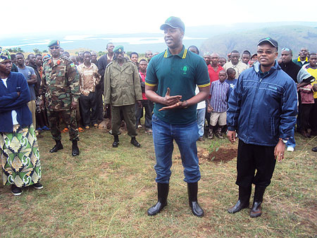 The Permanent Secretary in the Ministry of Forestry and Mines, Antoine Ruvebana, addresses residents of Kirehe, yesterday, as the district mayor, Protais Murayire, looks on. This was during the occasion to mark the official end of the national tree planti