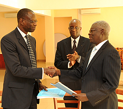 Alassane Ba, Francois Rutishisma and Gervais Ntaganda during the signing yesterday (Photo; T. Kisambira)