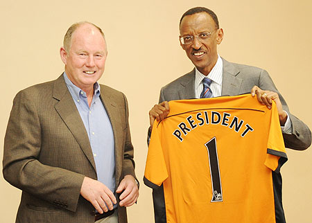 President Paul Kagame receives a Wolves jearsey from  Steve Morgan, the owner of Premier League Wolverhampton Wanderers yesterday (Photo; T. Kisambira)