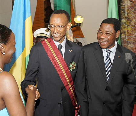 President Kagame being congratulated by Foreign Affairs Minister, Louise Mushikiwabo, after receiving Beninu2019s highest honour from President Yayi Boni. (Photo Urugwiro Village)