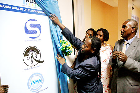 Minister of Trade and Industry, Monique Nsazabaganwa unveilling the RBS logos on Friday (Photo T.Kisambira)