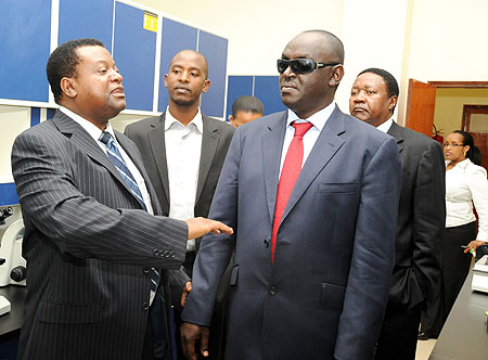 KIST Rector, Prof. Abraham Atta Ogwa (L) with Rwandau2019s representative to EALA, James Ndahiro, during the tour (Photo; T. Kisambira)