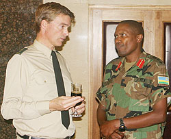 Col. Ben Klappe talking to Col. Peter Karimba of J3 yesterday ( Courtesy photo)