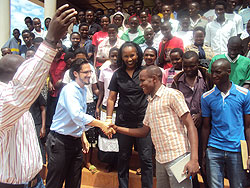 Dr. Peter Drobac PIH country Director congratulating a promising student. Photo by S. Rwembeho.