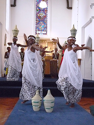 Hope Ihozo, Umutoni Clarisse dancing with the Peace Basket.