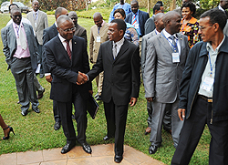 UN Resident coordinator Aurelien Agbenonci (L) greets Antonio Pedro from UNECA and other Participants of the meeting. (Photo J Mbanda)