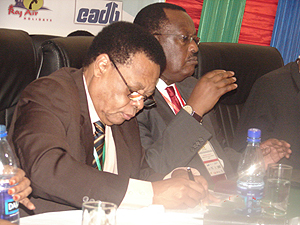 EAC Secretary General Juma Mwapachu and Uganda's vice premier Eriya Kategaya during the forum in Mwanza yesterday (Photo G Muramira)