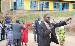 State Minister Dr Mathias Harebamungu joins Kicukiro leaders in celebrations at the launch of 9YBE classrooms yesterday (Photo J Mbanda)