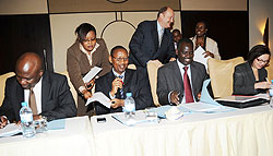 Ministers John Rwangombwa of Finance and Stanislas Kamanzi of Lands and Environment sign MOU with Development Partners (Photo J Mbanda)