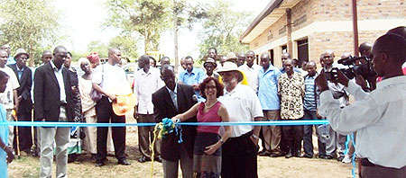 Anne Casper, US Embassyu2019s deputy chief of mission cutting the ribbon to inaugurate water and can washing facilities in Nyagatare (Photo D ngabonziza)