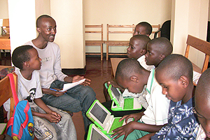 Desire Rwagaju mentoring children during OLPC camp.