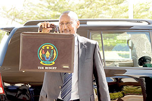 John Rwangombwa heading to parliament to present his first budget in June 2010 (file photo)