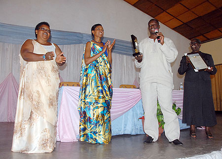 Minister Habineza shows off the award at the ceremony on Friday. Courtesy photo