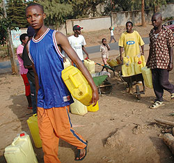 Kigali residents trekking for water. Water crisis has been reported in hilly parts of the city (File Photo)