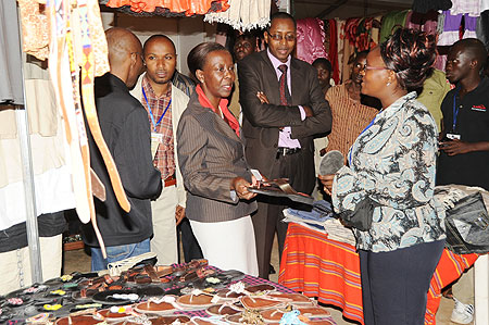 Foreign Affairs Minister, Louise Mushikiwabo (C) visits one of the Stalls at the Diaspora Expo. (Photo J Mbanda)