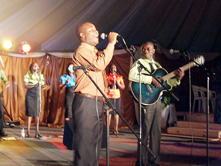 Apollinaire singing along with Shemeza group.