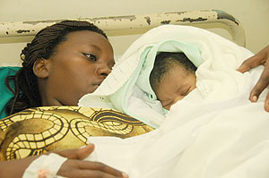 Delphine Uwimbabazi with her Christmas bundle of joy (Photo / T. Kisambira)