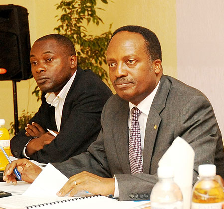 Dr. Jean Baptiste Habyarimana, the Executive Secretary of NURC, and Reverien Interayamahanga during the validation meeting( Photo T. Kisambira)