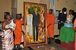 Inmates at 1930 displaying a painting they made of President Paul Kagame at the event yesterday (Photo / S. Mugisha)