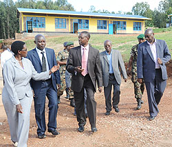 State Minister Mathias Harebamungu and Local leaders tour Kagarama primary school in Kicukiro District. 9-YBE  was priority in 2010 (File photo)