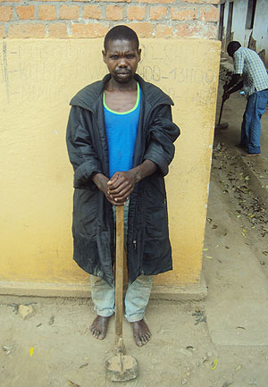 Adrien Ubyinanaryo and the hoe  used to kill his wife (photo S Nkurunziza)