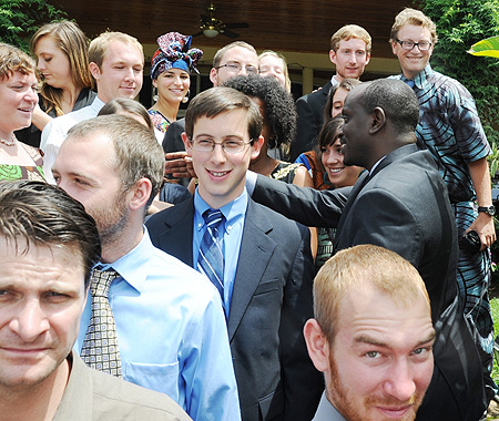 Health Minister Richard Sezibera (R) greeting the Peace corps volunteers at the US Ambassador's residence yesterday. (Photo J Mbanda)