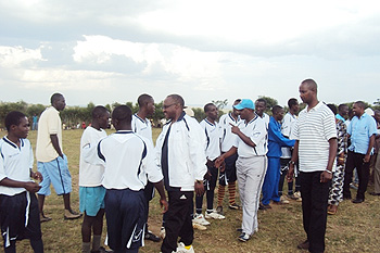 Minister Protais Musoni  greeting players before the friendly match on Sunday.(Photo.Dan Ngabonziza)