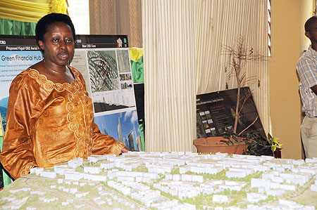 City Mayor Aisa Kirabo Kacyira inspects the City Masterplan at the KCC One Stop Centre yesterday  (Photo / T. Kisambira)