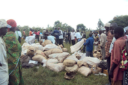 Residents gathering around smuggled illicit brew before the contraband was destroyed 