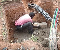 A man lays Fibre Optic cable. The countrywide rollout of the cable has been completed (File Photo)