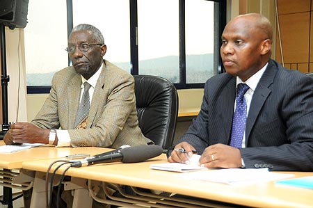 NEC Chairman, Chrysologue Karangwa (L) and Charles Munyaneza, the Executive Secretary. talk to the press  yesterday  (Photo T.Kisambira)