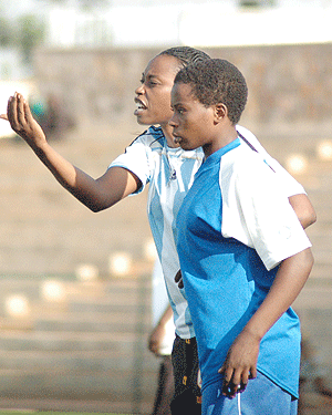 AS Kigali women football team coach Grace Nyinawumuntu passing on instructions to her players during last yearu2019s league. She wants to lead the side to a third successive league title. (File Photo)