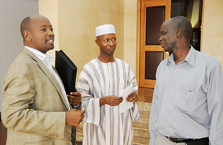 Ministers James Musoni (L) and Fazil Harerimana withthe Governor of the Eastern Province, Ephraim Kabayija (R), after the meeting yesterday (Photo T Kisambira)