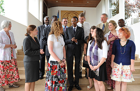 President Kagame chats with students from John Caroll University  after their courtesy call at Village Urugwiro (Photo Village Urugwiro)