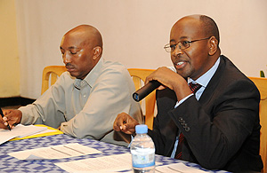 Eugu00e8ne Barikana (L) with James Musoni the Minister of Local Governmemt during the meeting ( Photo T.Kisambira)