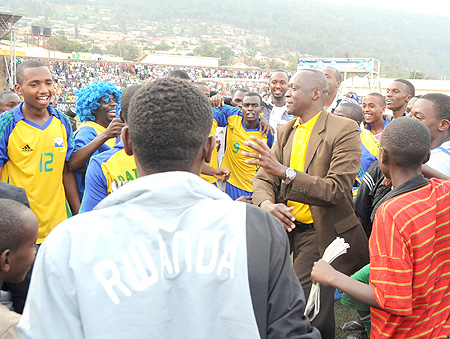 Sports minister Joseph Habineza can't hide his excitement after Tuesday's game were the junior wasps edged Egypt 1-0 to qualify for the 2011 Fifa U-17 World Cup. (Photo. T. Kisambira)