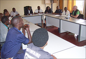 JRS Country Director Gerard Clarke (extreme right) in a meeting with District authorities prior to throwing out journalists. (Photo / A. Gahene)