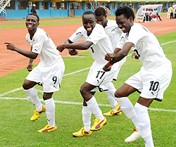 Burkina Faso players celebrate after scoring the equaliser eight minutes into the second half. The West Africans are through to the final after beating Congo Brazzaville on penalties yesterday. (Photo T. Kisambira)