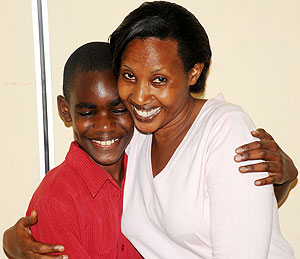 Jesse Mugisha the overall winner of Primary Examination with his aunt Annette Mutangwa  (Photo T.Kisambira)