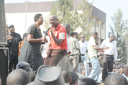 Mayor of Kigali City, Dr Aisa Kirabo Kacyira (clad in black attire) joins singer, Eric Senderi on stage.