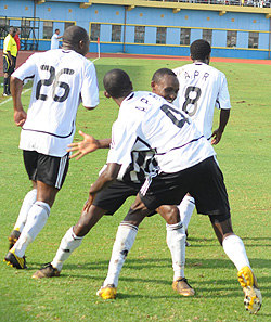 APR's leftback Donatien Tuyizere (4) celebrates with teammate, JC Iranzi after putting APR on level terms in the first half. (Photo; T. Kisambira)