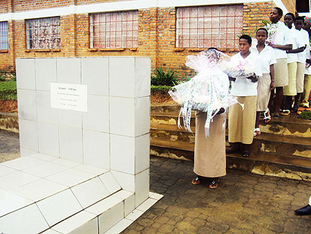 Students prepare to lay wreaths on one of the graves of heroes from Nyange Secondary School (File photo)