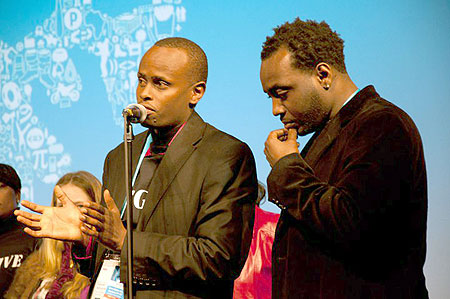 From (l-r), the Executive Producer of Kinyarwanda, Ishmael Ntihabose speaking at the event, looking on is the author/producer of the movie, Alrick Brown (courtesy photo).